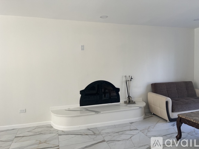 A living room with a fireplace and a couch.