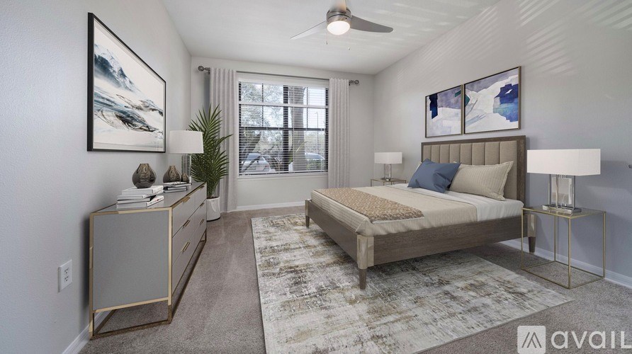 A bedroom with a bed, nightstand, and a rug.