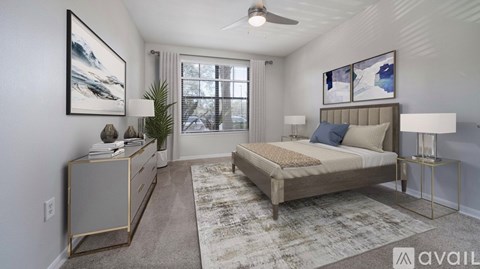 A bedroom with a bed, nightstand, and a rug.