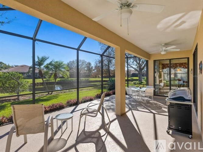 A sunny patio with a table and chairs.