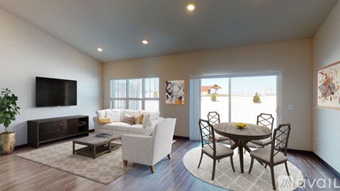 A living room with a white couch, a black TV, and a glass table with chairs.