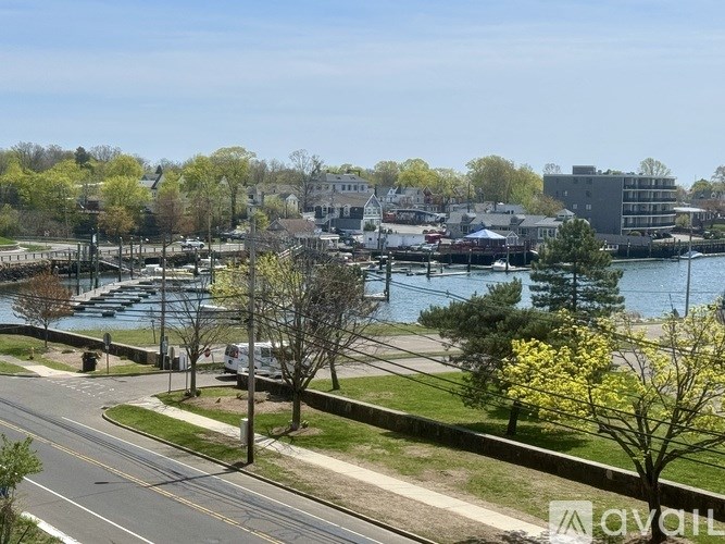 A view of a harbor with boats and buildings.