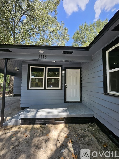 A house numbered 3113 is shown with a white door and two windows.