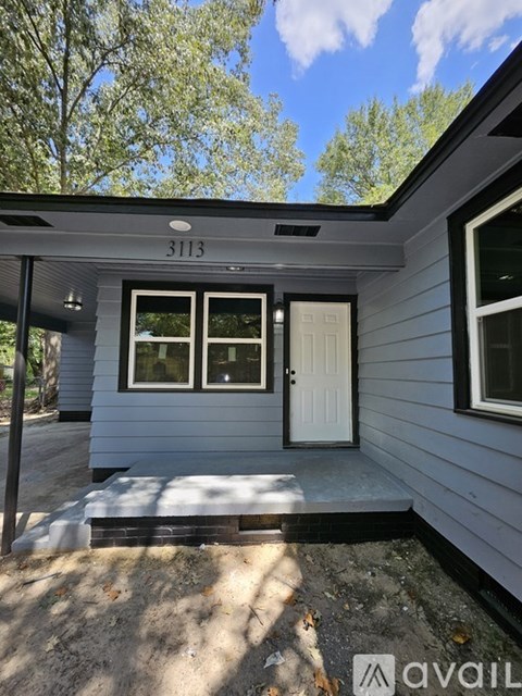 A house numbered 3113 is shown with a white door and two windows.