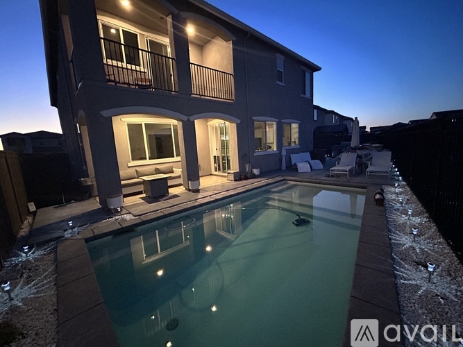 A house with a pool in the backyard.