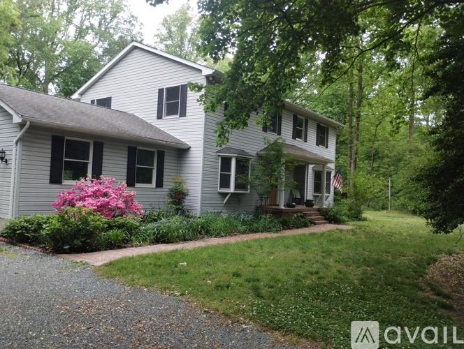 A house with a gravel pathway leading to the front door.