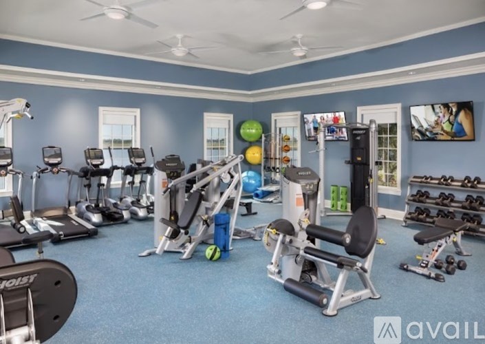 A well-equipped gym with various exercise machines and equipment.