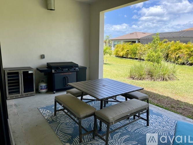 A patio with a table and benches is shown.