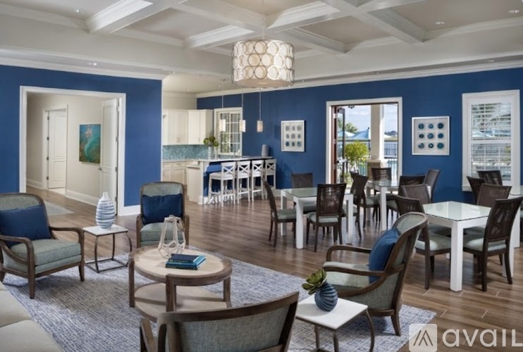 A living room with blue walls and furniture.