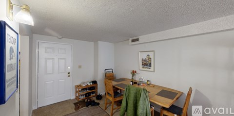 A small room with a table and chairs.