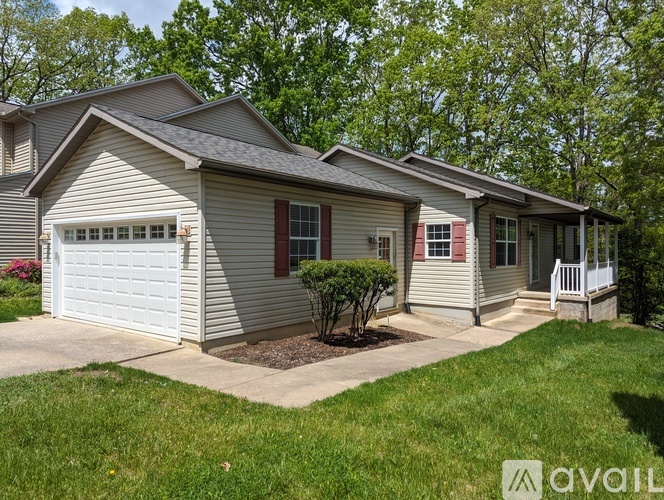 A house with a garage and a front yard.