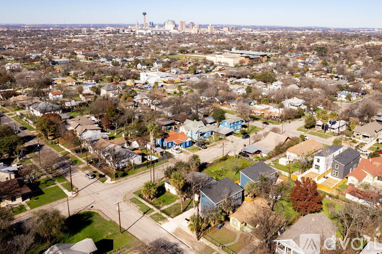 A bird's eye view of a residential area with houses and streets.