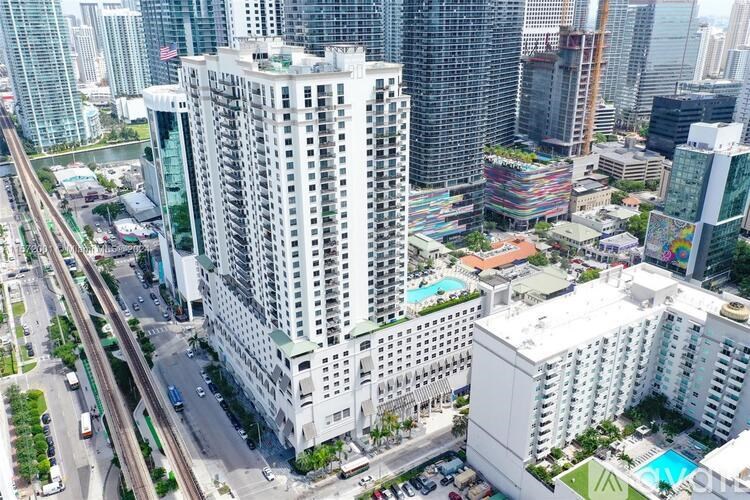 A cityscape with a large white building in the center.