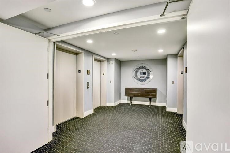 A hallway with a bench and a sign that says 1800.