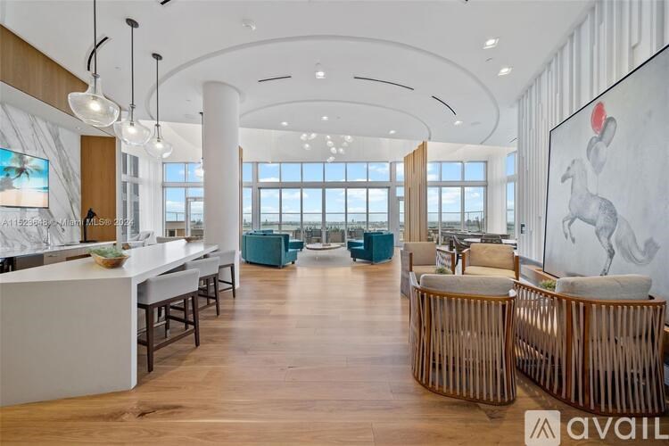 A modern interior space with a bar area and seating.