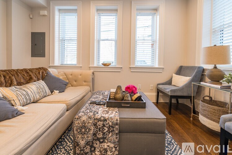 A living room with a sofa, a chair, and a coffee table.
