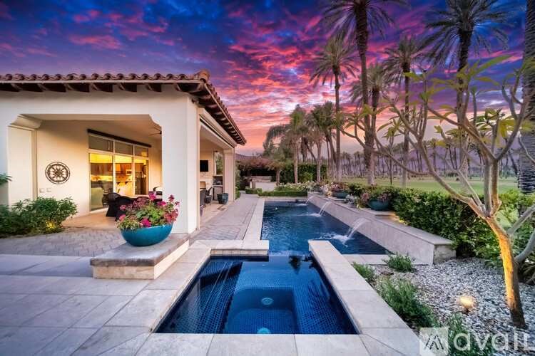 A house with a pool in the backyard.