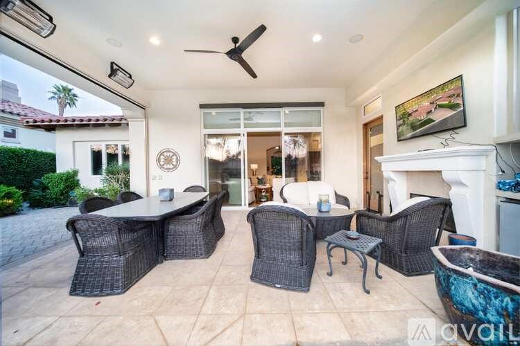 A patio with a table and chairs is shown.