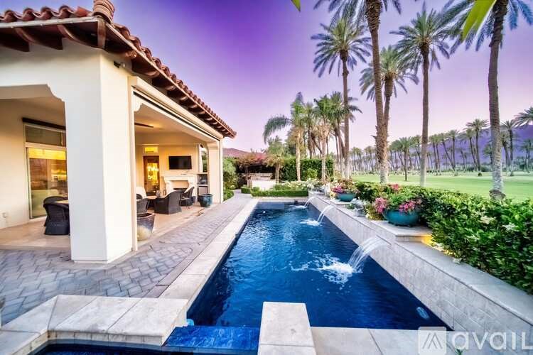 A house with a pool in the backyard.