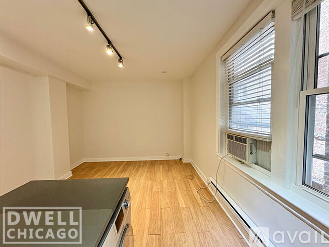 A room with a Dwell Chicago sign on a table.