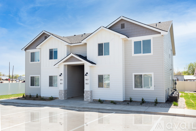 A modern two-story house with a garage is available for purchase.