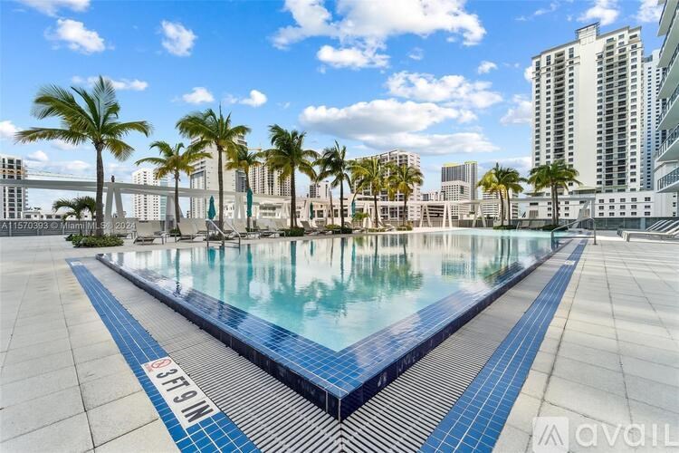 A pool with the word "SUNNY" written on the edge.