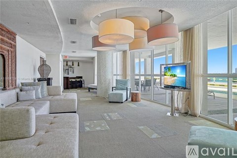 A living room with a television and a couch.