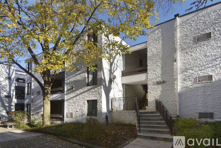 A stone building with a tree in front of it.