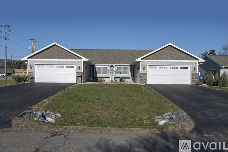 A house with two garages is for sale.