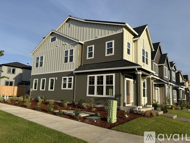 A row of houses with a sign that says "available" in front of the first one.