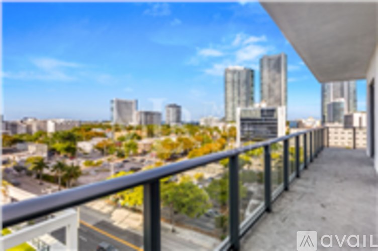 A balcony overlooks a cityscape with tall buildings.