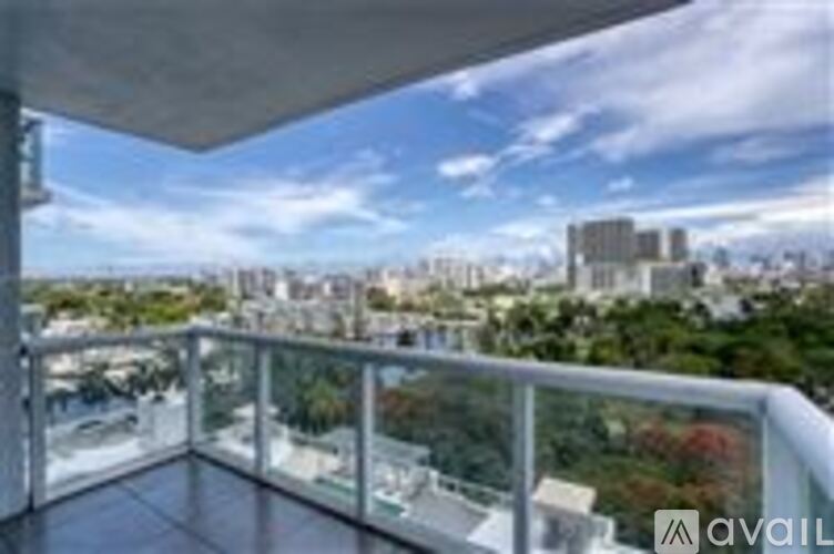 A balcony with a view of a cityscape.