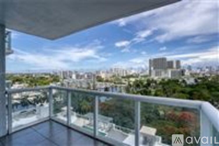 A balcony with a view of a cityscape.