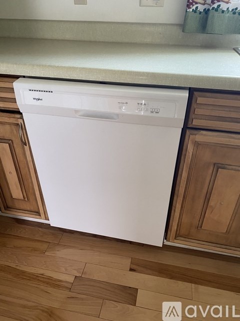 A white dishwasher is installed in a kitchen.