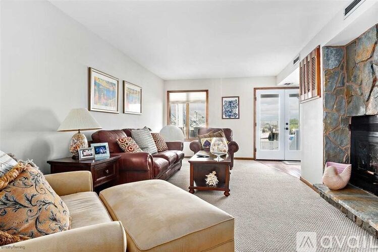 A living room with a fireplace and a couch.