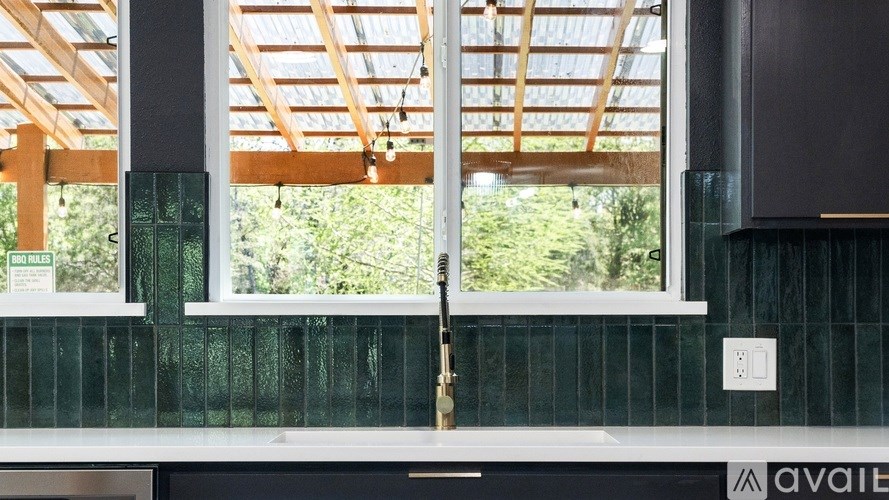 A glass window with a wooden frame and a white base.