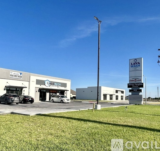 A car wash business named Laya Wash is located in a parking lot.