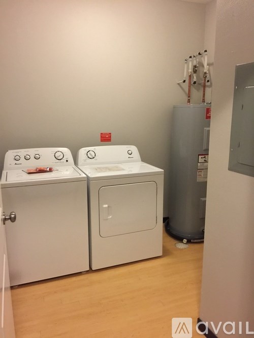 Two washing machines in a laundry room.