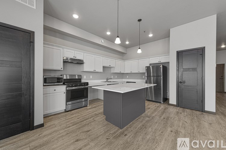 A modern kitchen with a large island in the center.
