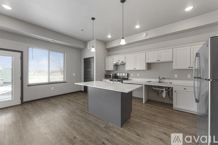A modern kitchen with a large island in the center.