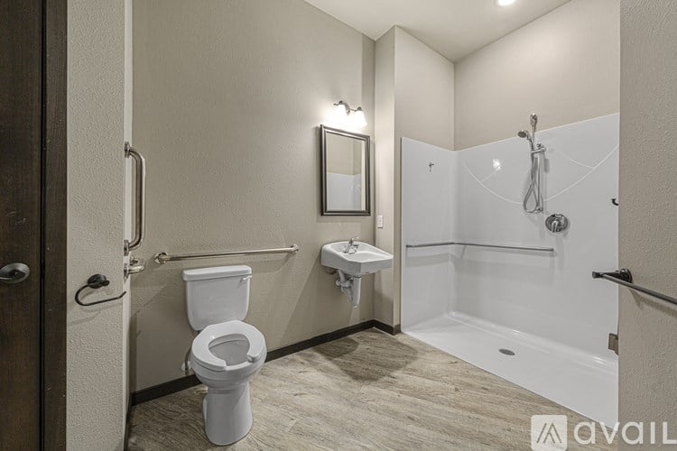 A bathroom with a toilet, sink, and bathtub.