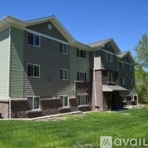 A large two-story house with a balcony on the second floor.