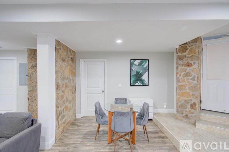 A dining area with a table and chairs is shown.