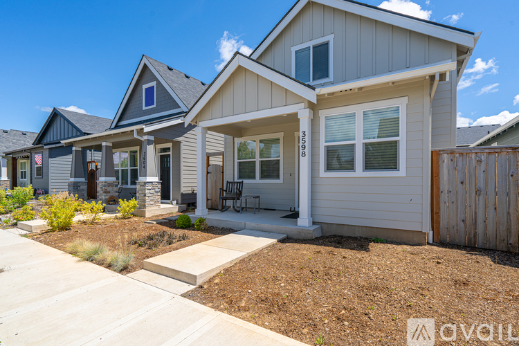 A house with a front yard and a fence.