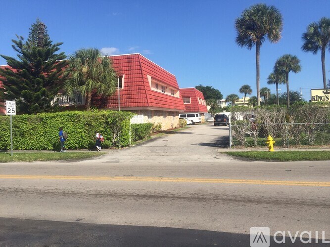 A red building with a sign that says Kings is in the background.