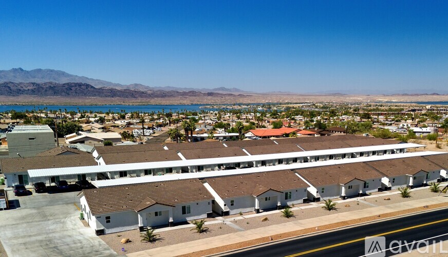 A bird's eye view of a residential area with houses and a road.