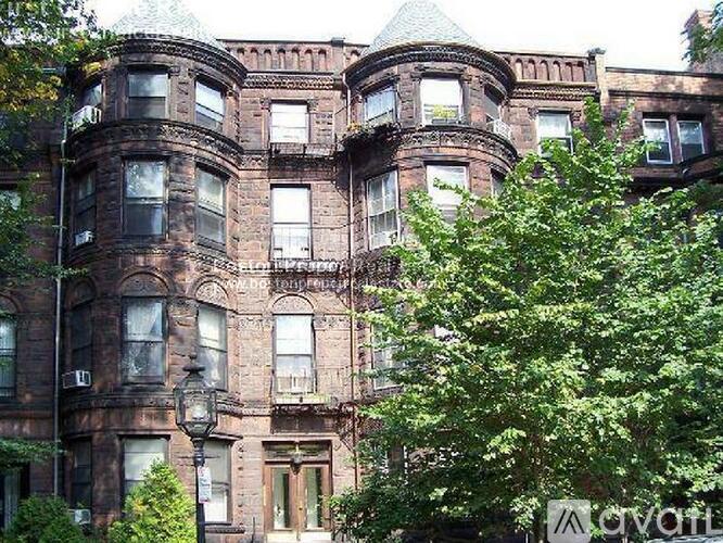 A large, old building with many windows and balconies.