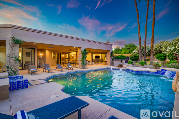 A modern house with a pool in the backyard.