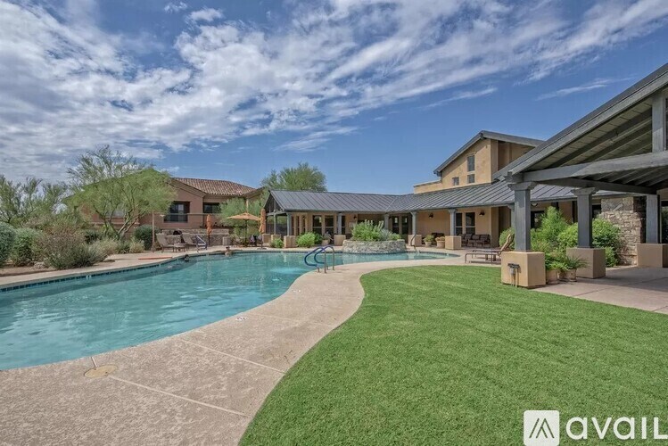 A large house with a pool in the backyard.