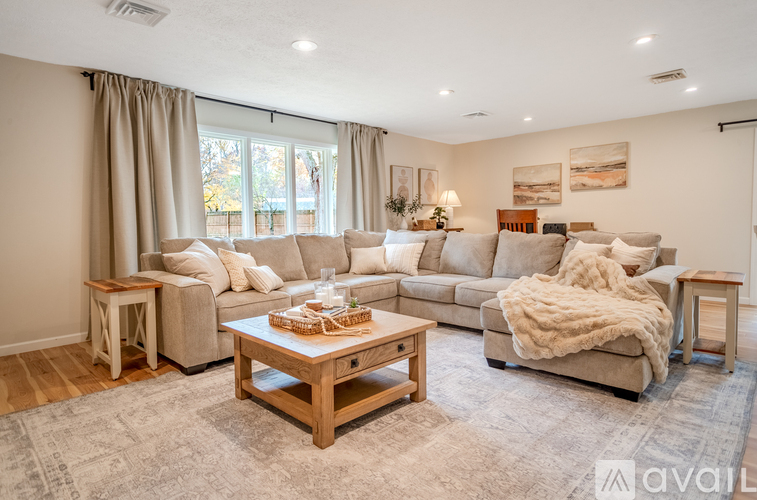 A living room with wooden floors and furniture.
